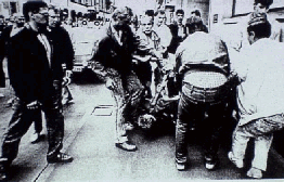 Stasi beats up a demonstrator