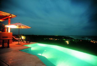 Night view of pool and Four Seasons Resort