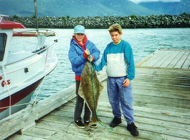 picture of eli, darrell & a fish